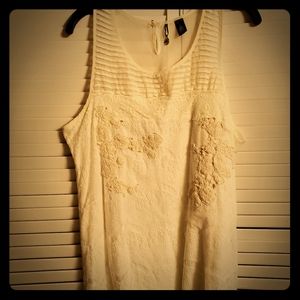 Sleeveless creme colored blouse